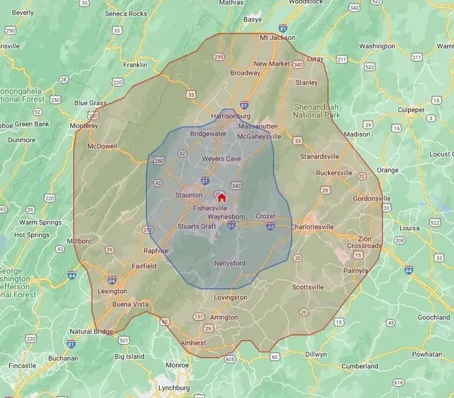 Villa Views service area map showing no-fee zone (blue) and extended zone at $1/mile (red) across the Shenandoah Valley, VA