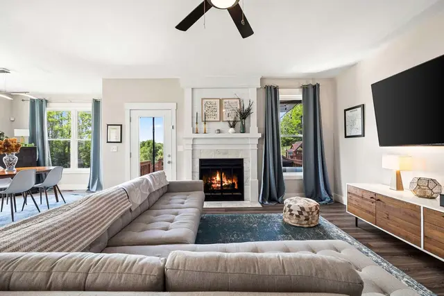 Interior photography  -  living room with white fireplace and blue accents