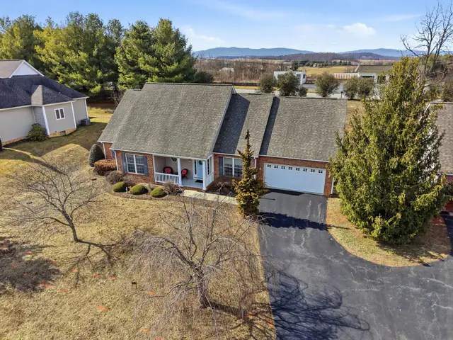 Drone photo of a Staunton VA home with the Blue Ridge Mountains on the horizon