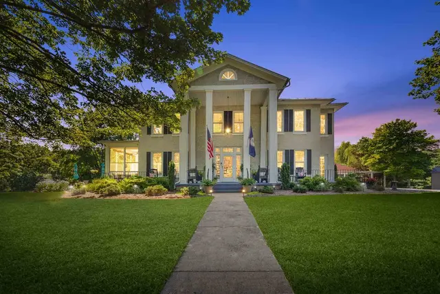 Blue hour real estate photography  -  Greek Revival home lit at twilight